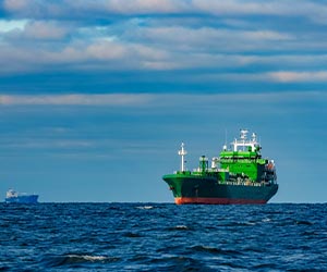 Green vessel on the ocean