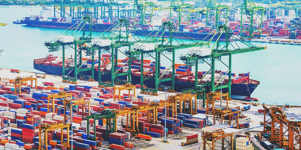 Image of the Port of Singapore with ship loading in background